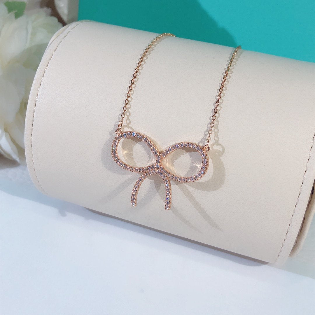 TIFFANY CLAW SET RHODIUM PLATED BOW NECKLACE