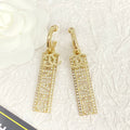Chanel Text Diamond Paved Light Gold Drop Earrings
