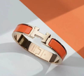 HERMES H ORANGE BRACELET