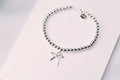 TIFFANY STERLING SILVER BOW BEAD BRACELET