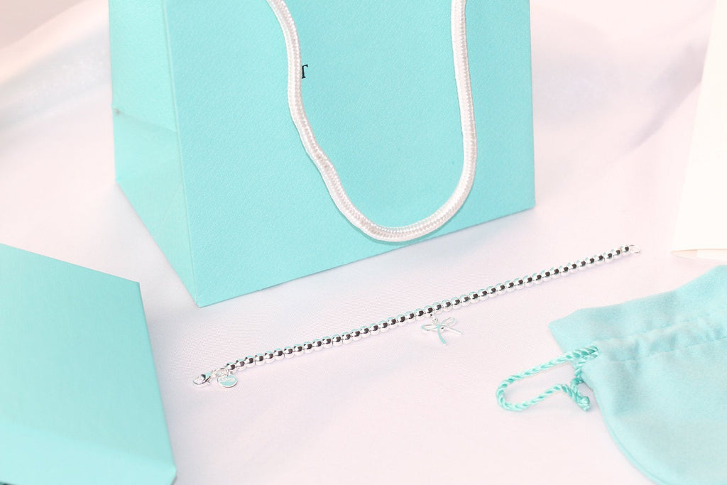 TIFFANY STERLING SILVER BOW BEAD BRACELET