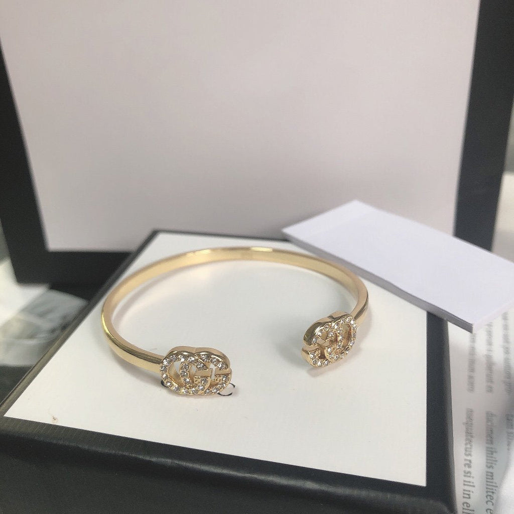 GUCCI GOLD RUNNING DIAMOND LOGO BANGLE BRACELETS