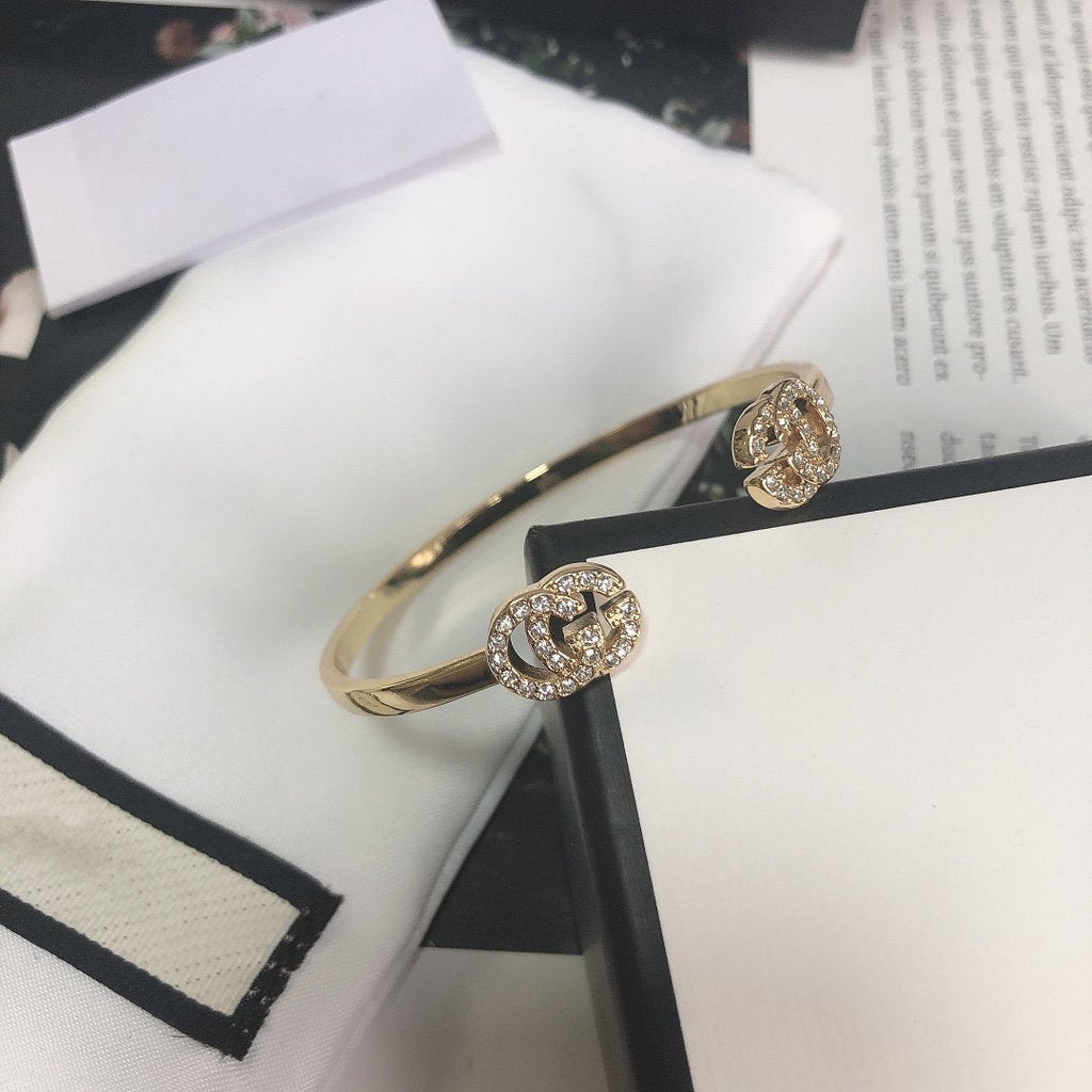 GUCCI GOLD RUNNING DIAMOND LOGO BANGLE BRACELETS