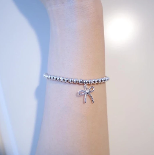TIFFANY STERLING SILVER BOW BEAD BRACELET