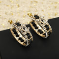 Chanel Double C Gold Leather Curved Hook Stud Earrings